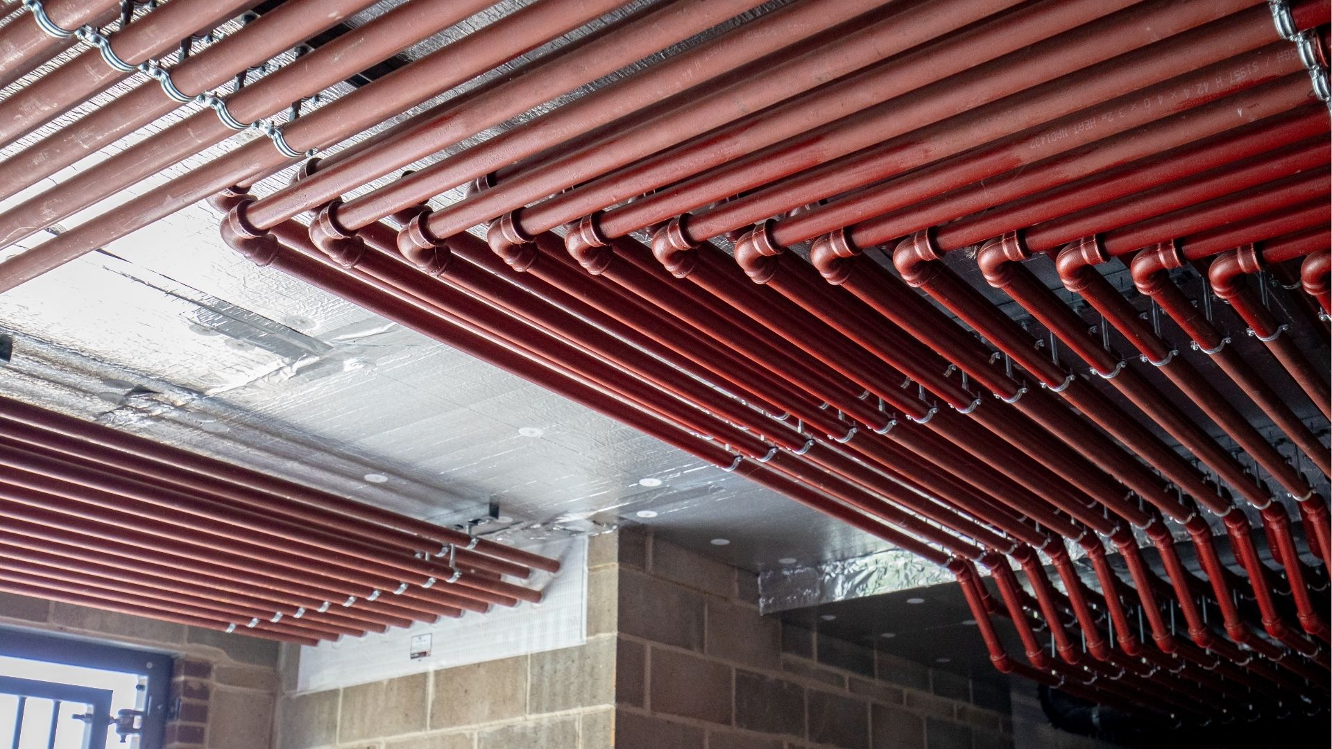 brymec malleable iron and threaded steel tube installed and painted red
