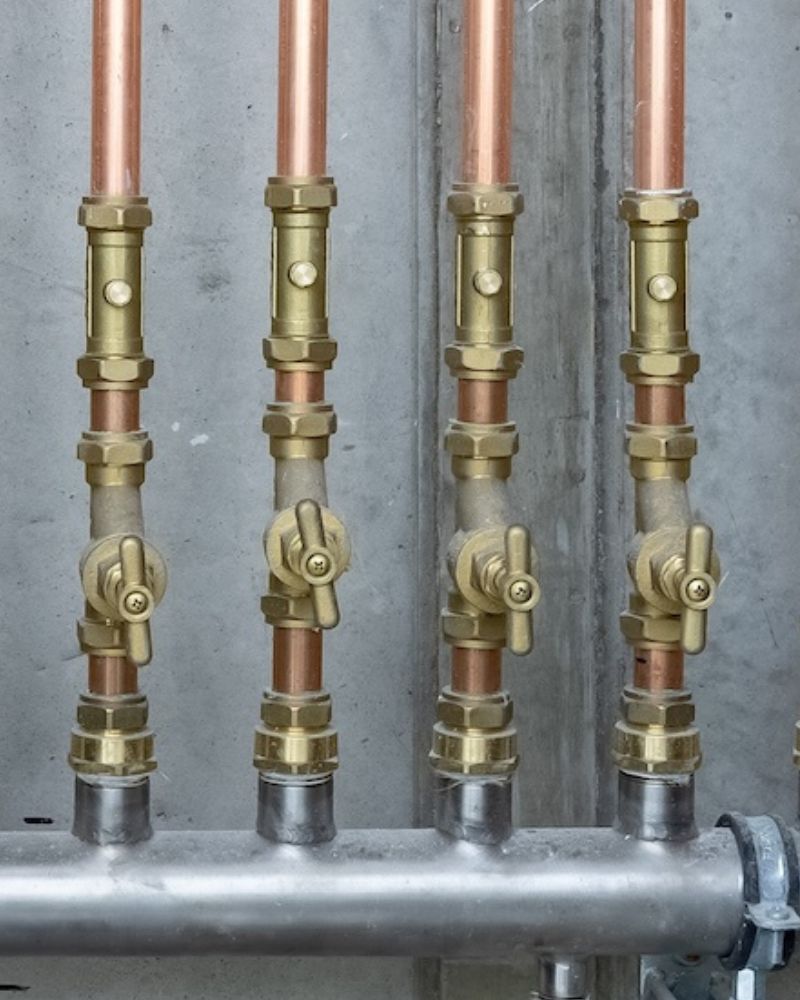 brymec brass compression fittings installed with copper pipe